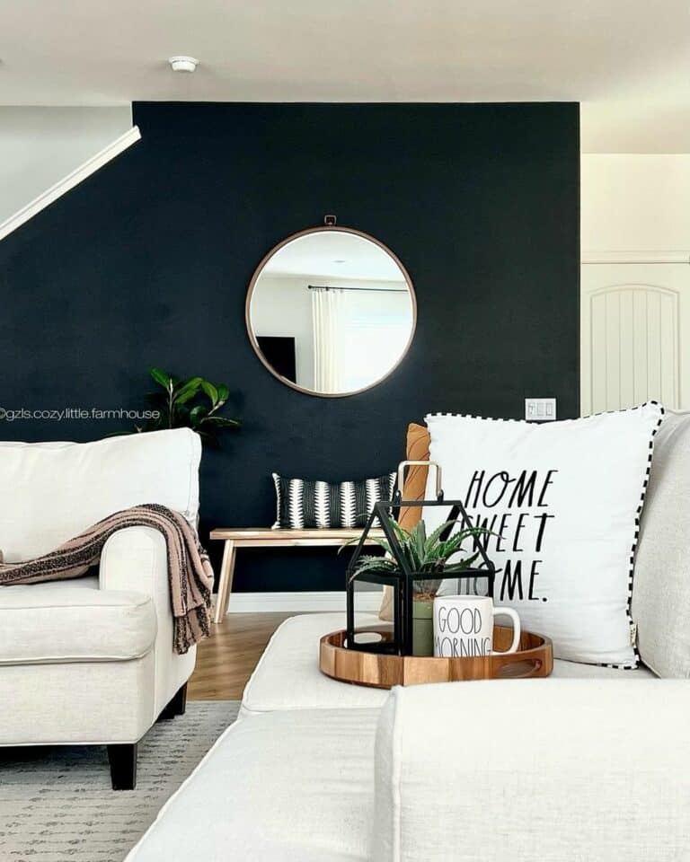 Farmhouse Living Room With White Sofas and Black Wall