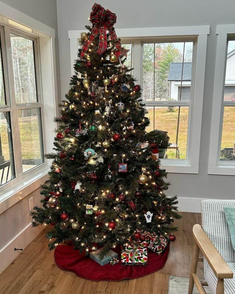 Festive Christmas Tree With a Plaid Bow Topper