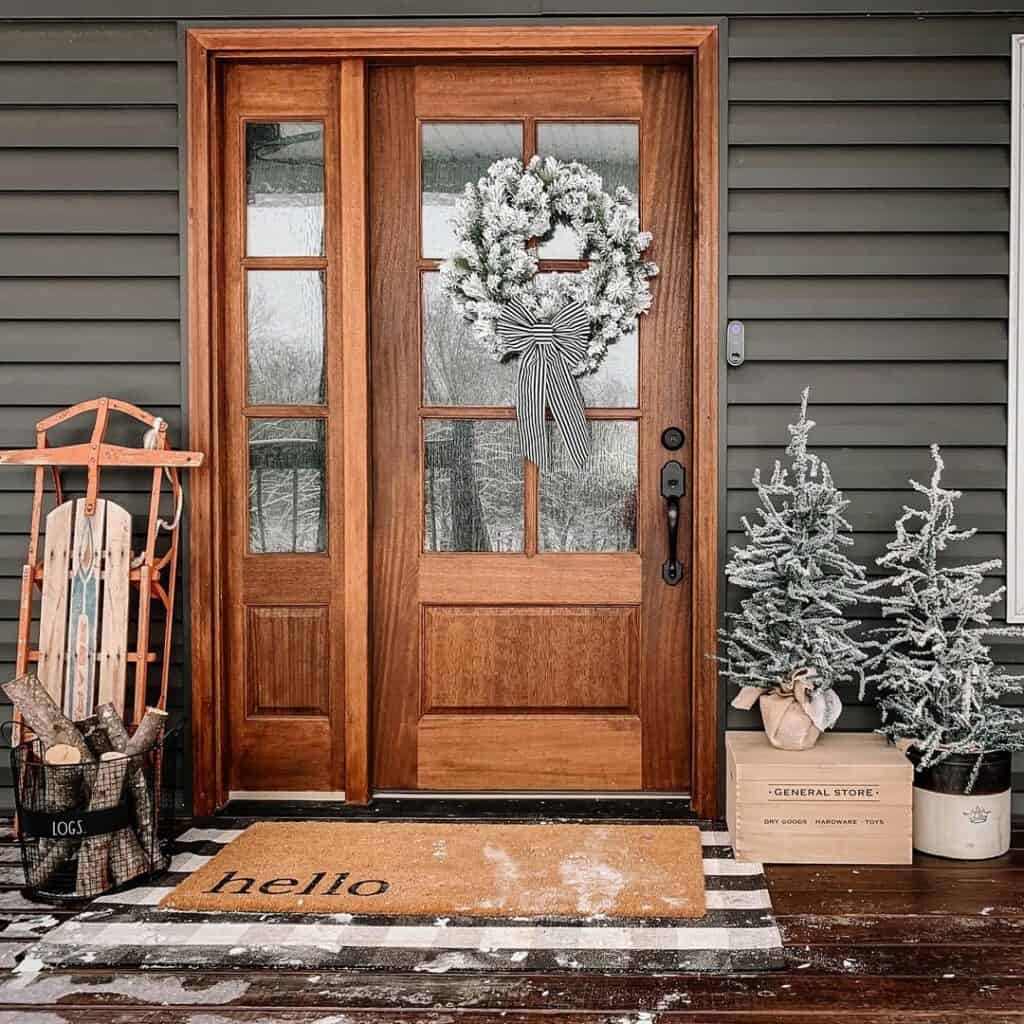 Gray and Wood Christmas Exterior With White Door Wreath