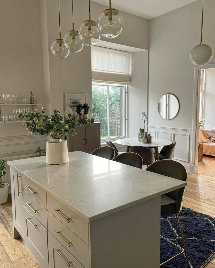 Light Gray Kitchen With Marble Kitchen Island and Seating