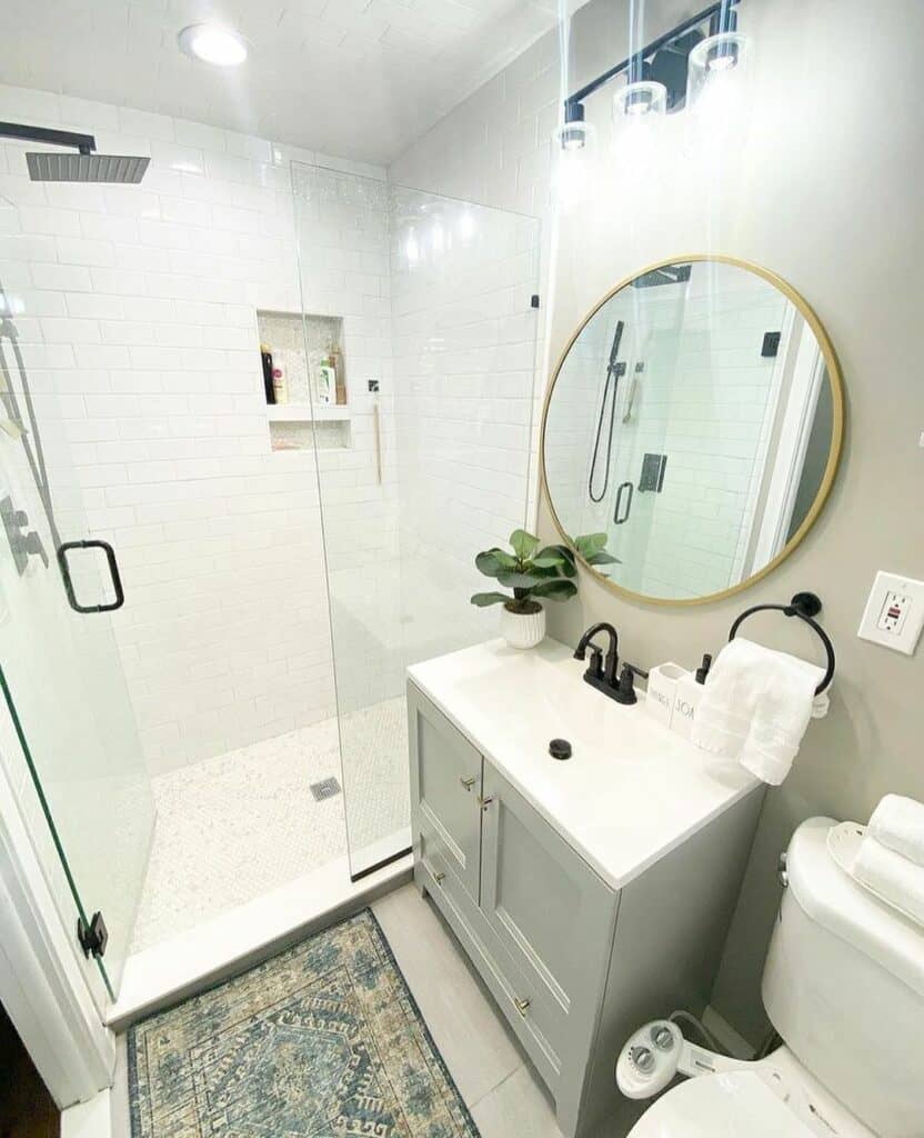 Light Gray Vanity Beneath a Brass Mirror - Soul & Lane