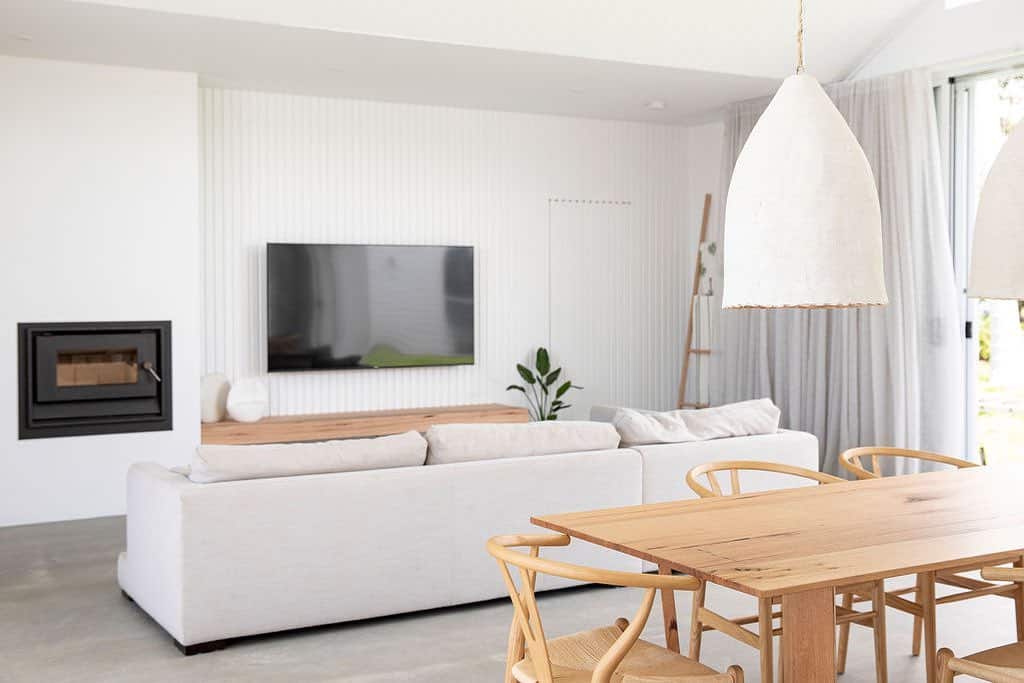 Light Wood Table Beneath White Pendants