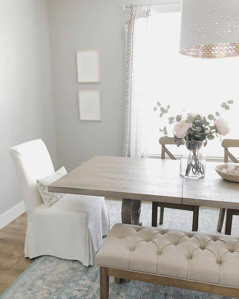 Light and Airy Farmhouse Dining Room With Upholstered Bench