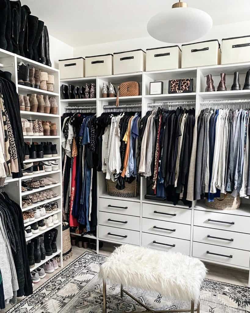 Master Closet With White Ottoman and Patterned Rug