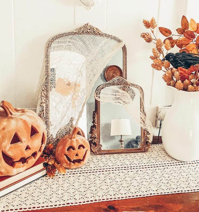 Mirrored Autumnal Reflections: Dual Elegance Meets Carved Pumpkins