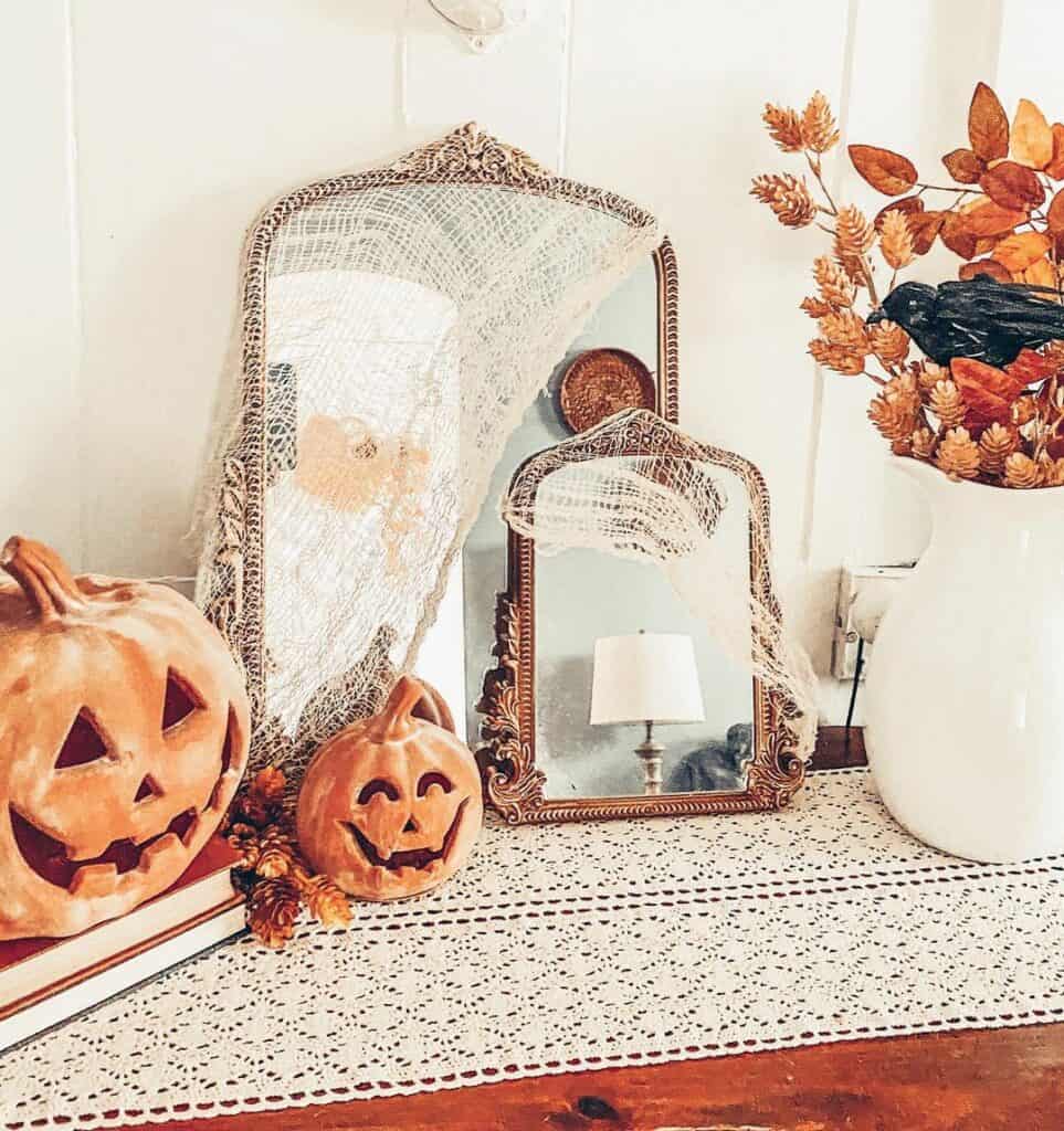 Mirrored Autumnal Reflections: Dual Elegance Meets Carved Pumpkins
