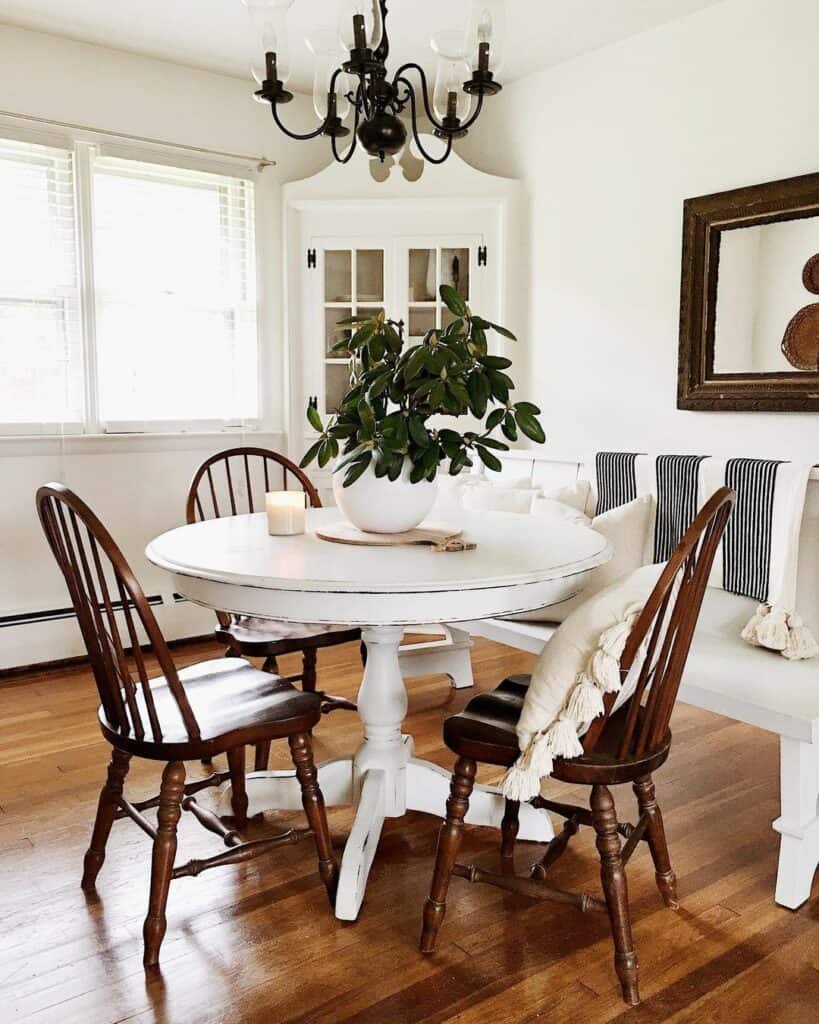 Mismatched Chairs Around a Pedestal Table