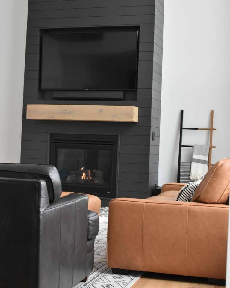 Modern Black and White Living Room With Wooden Mantel
