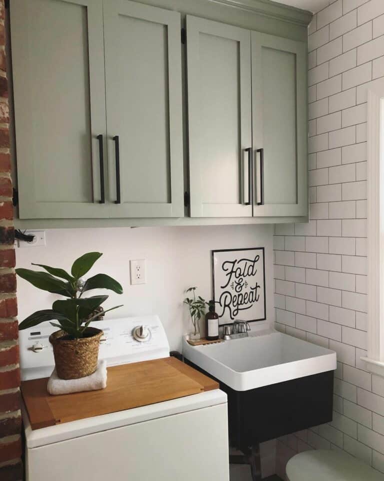 Modern Farmhouse Laundry Room With Sage Green Cabinets