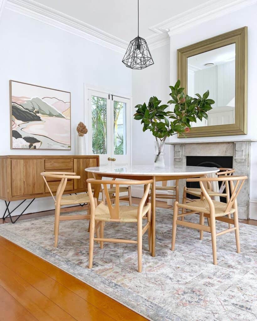 Modern Scandinavian Dining Room With Framed Art