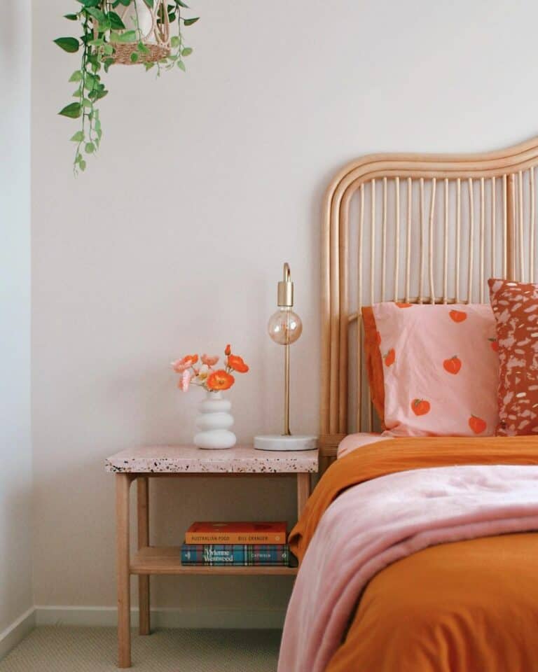 Orange Accented Bedroom With Wood Furniture