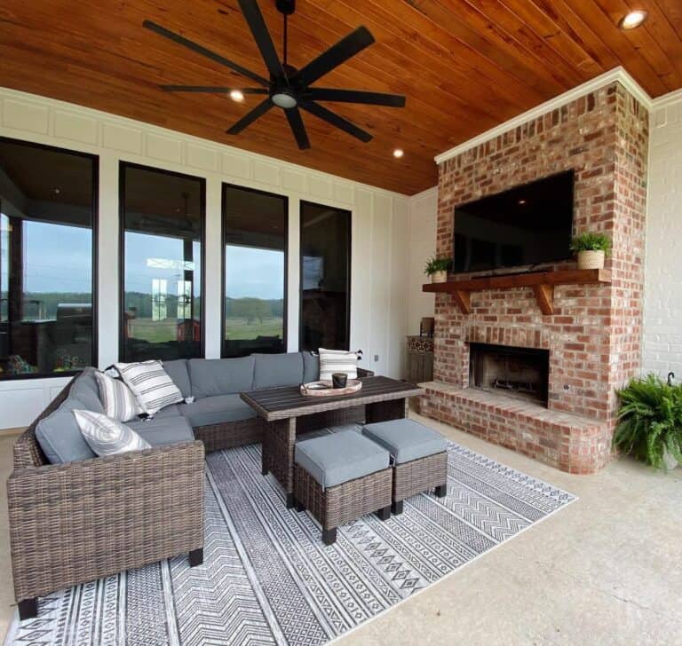 Outdoor Brick Fireplace With Wood Paneled Ceiling