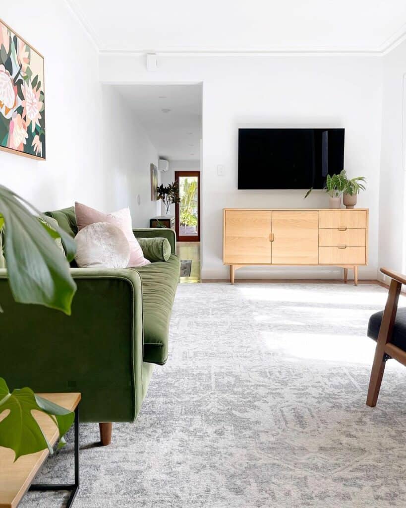 Sleek and Modern Living Room With Green Velvet Couch