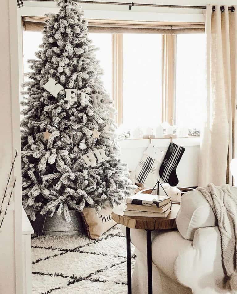 Snowy Flocked Tree Beside Window Sill Stockings