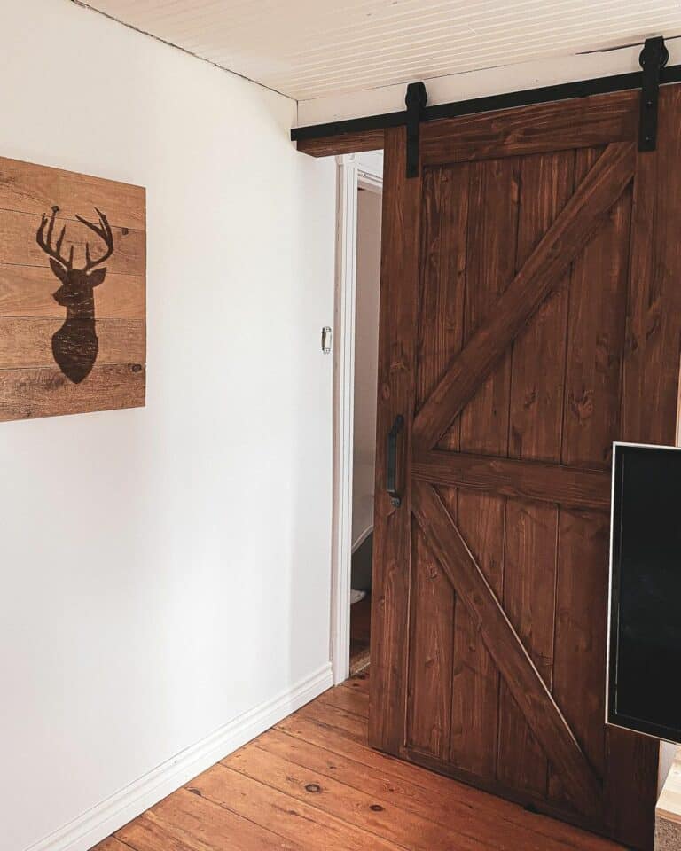 Stained Wood Flooring Below a Classic Wooden Door