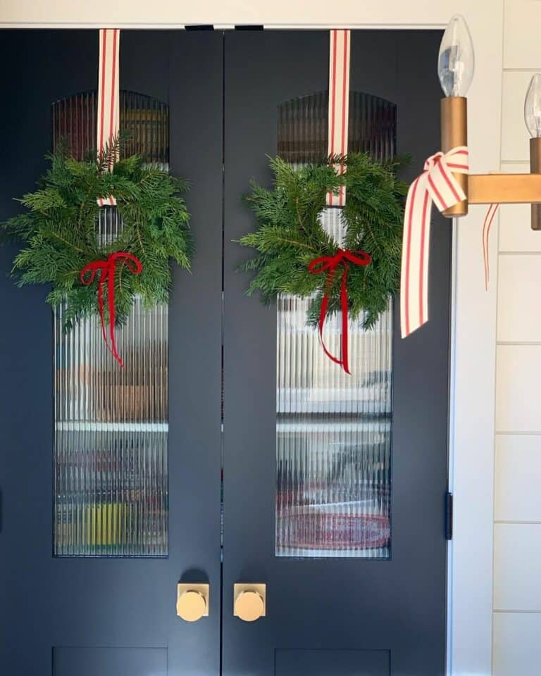 Symmetrical Winter Wreaths for Double Black Front Doors
