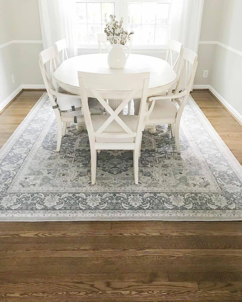 Vintage Rug Highlights a White Dining Table