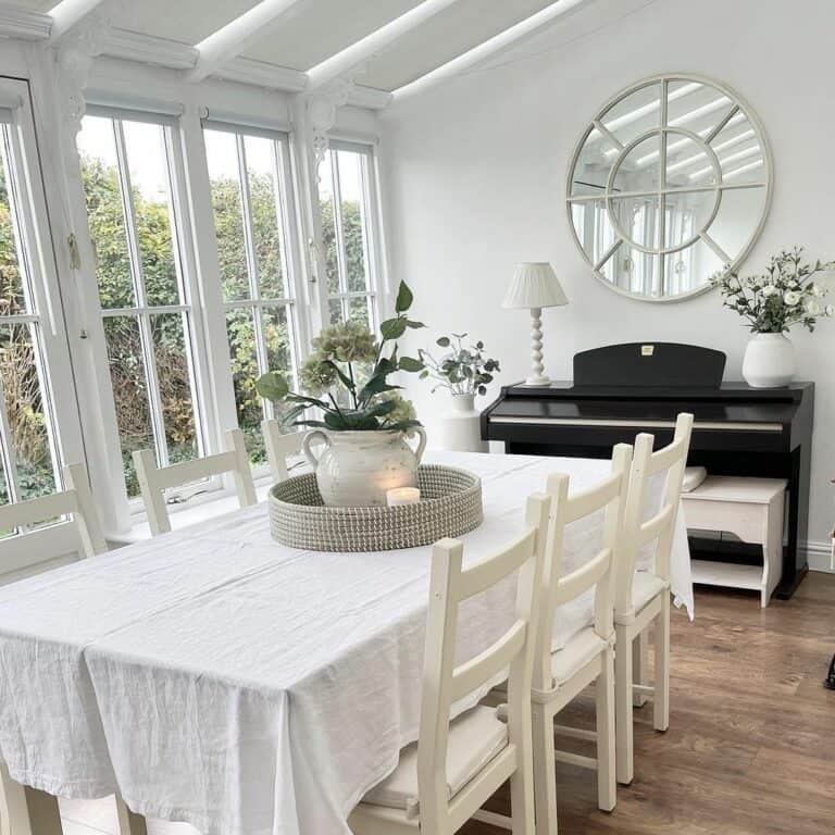 Wall of Windows to Illuminate White Dining Room