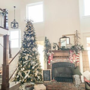 White Christmas Tree and Brick Fireplace in Living Room