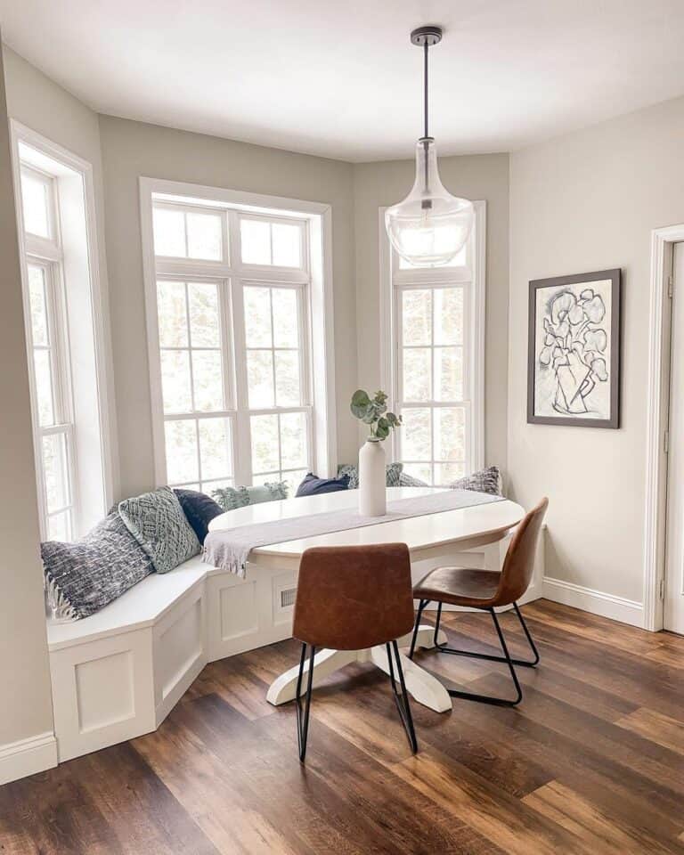 White Dining Room With Blue Cushions