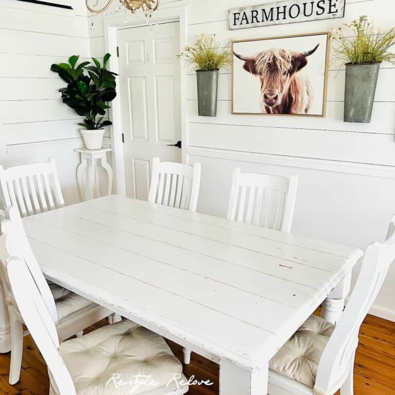 White Dining Room With Plant Décor