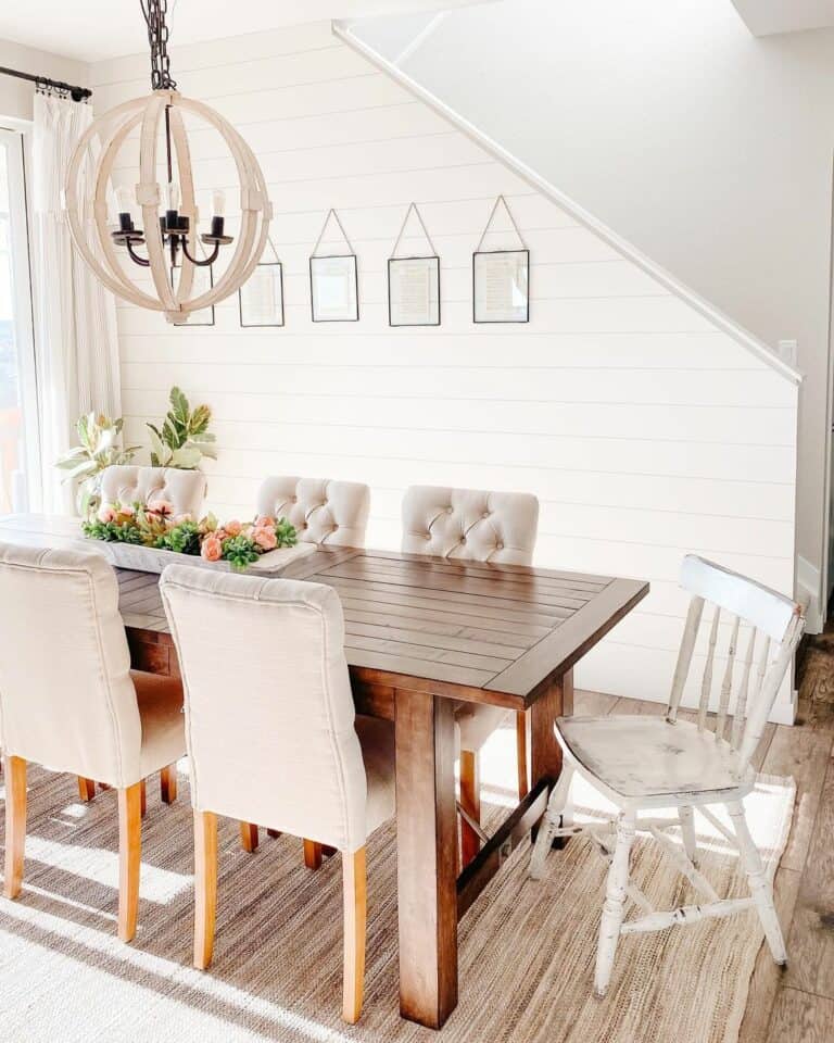 White Farmhouse Dining Room With Plant Décor