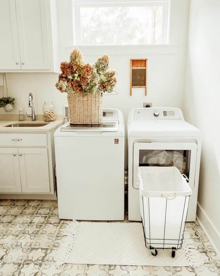 White Farmhouse Laundry Room With Patterned Tiles