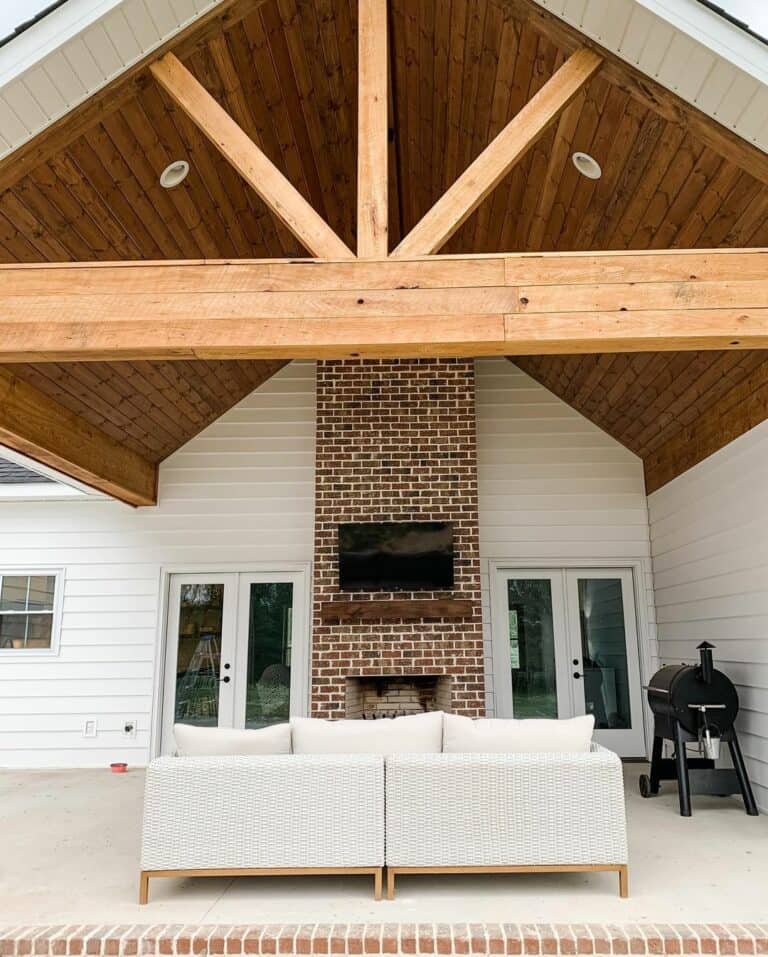 White Farmhouse Porch With Vaulted Wood Ceiling