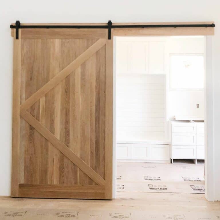 White Oak Door Reveals a White Mudroom