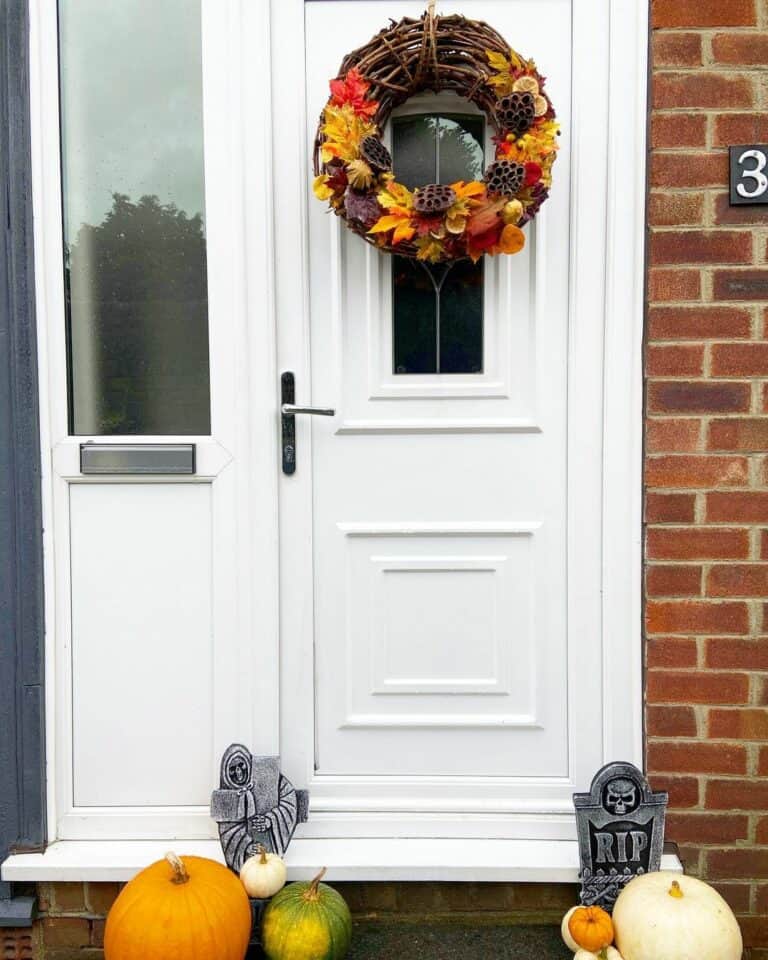 White and Brick Front Porch With Autumn Wreath