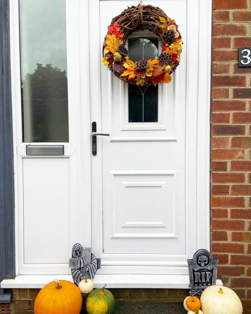 White and Brick Front Porch With Autumn Wreath
