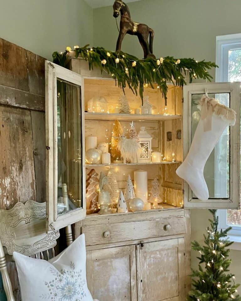 Winter Wonderland Decorations Fill an Illuminated Hutch