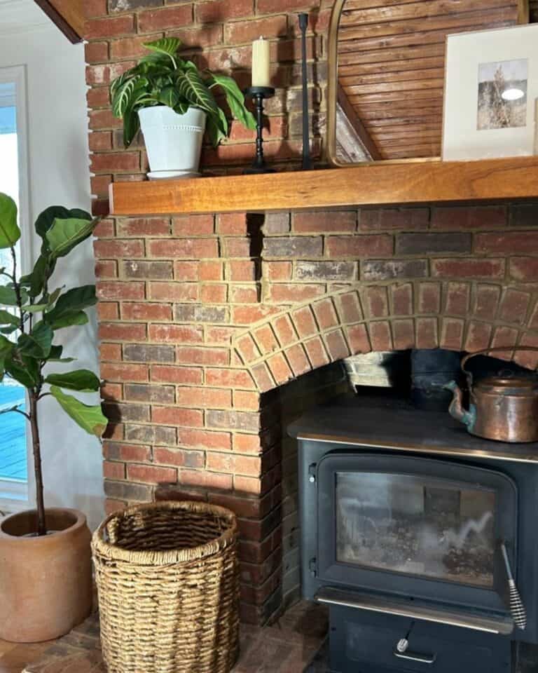 Wood Burning Fireplace With Brick Surroundings