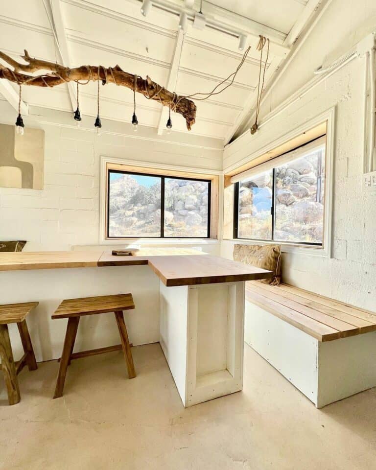 Wood and White Dining Room With Unique Light Fixture