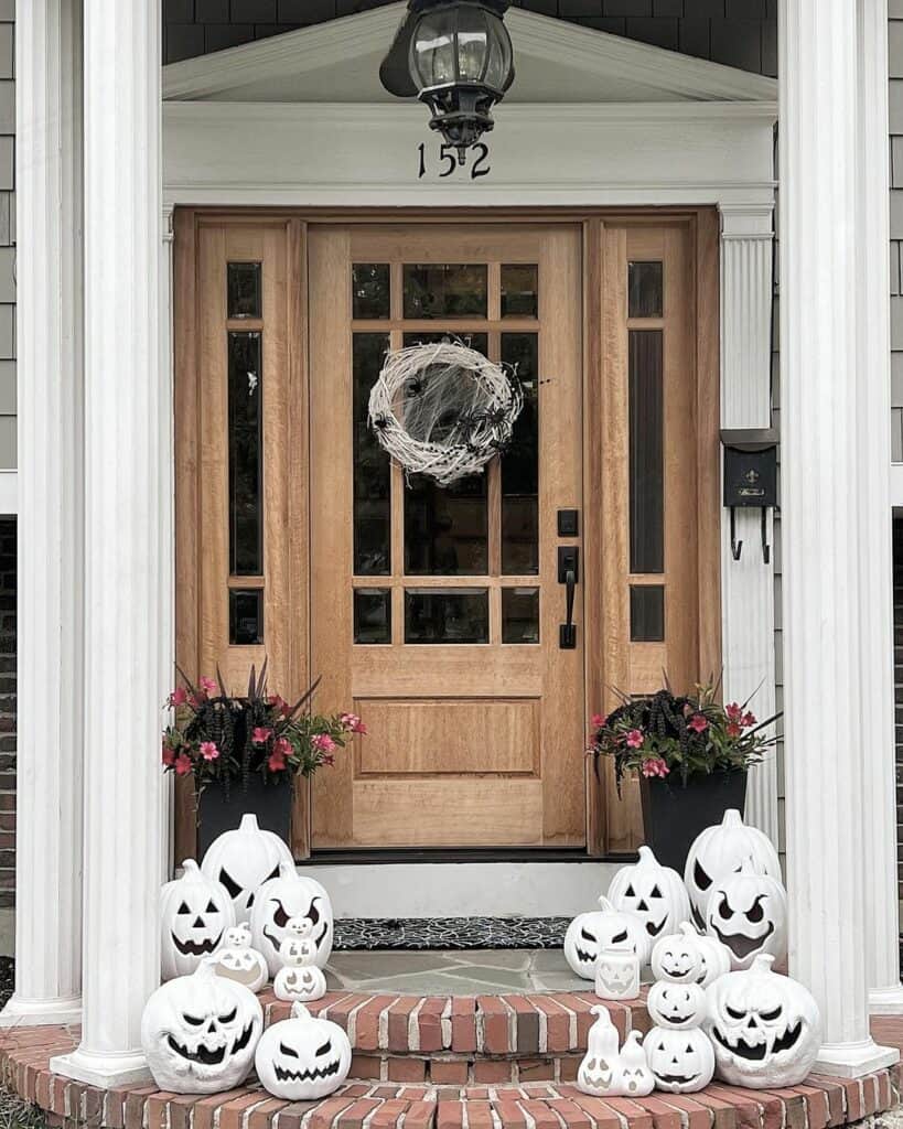 Wood and White Porch With Pumpkin Lanterns