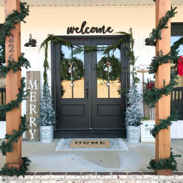 Wreaths With Bells and Gold String on Front Porch