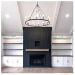 Black Vertical Shiplap Fireplace With Chandelier