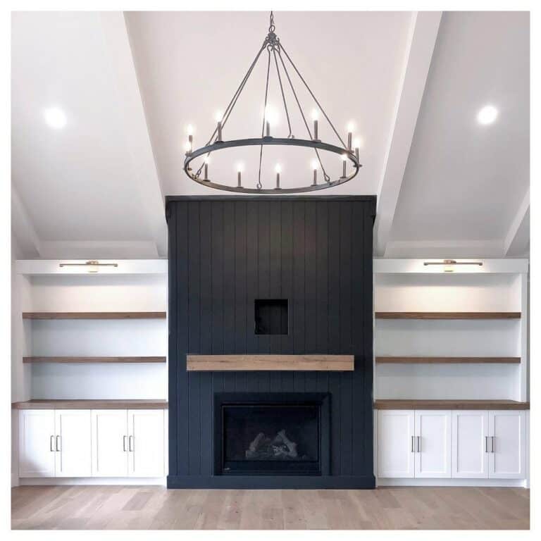 Black Vertical Shiplap Fireplace With Chandelier