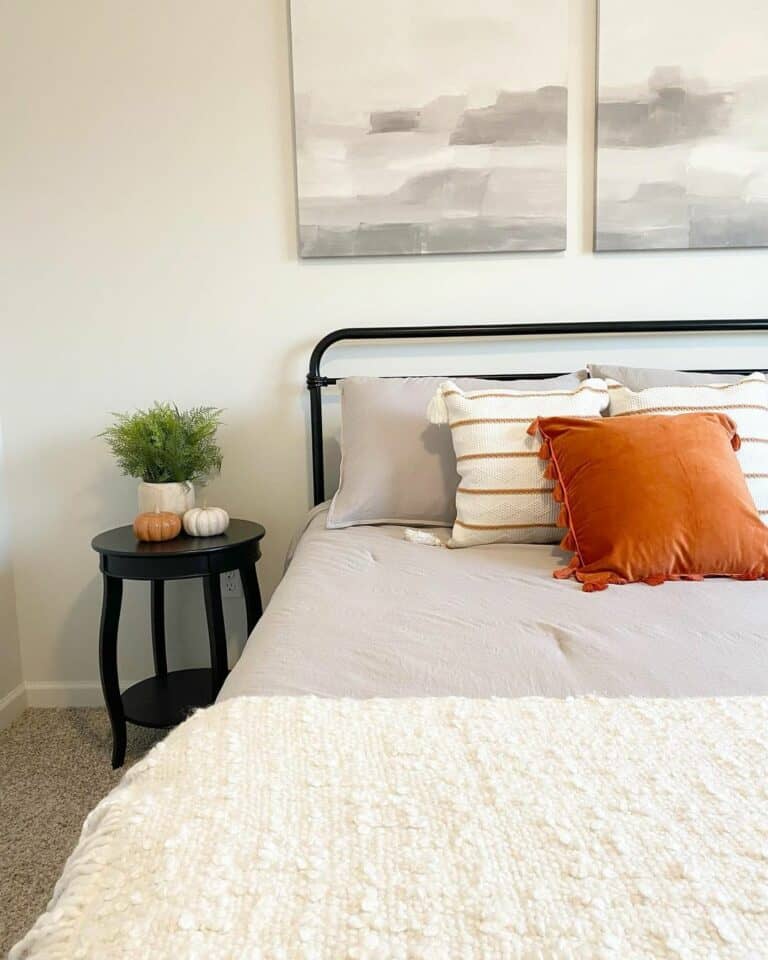 Burst of Orange In Neutral Bedroom