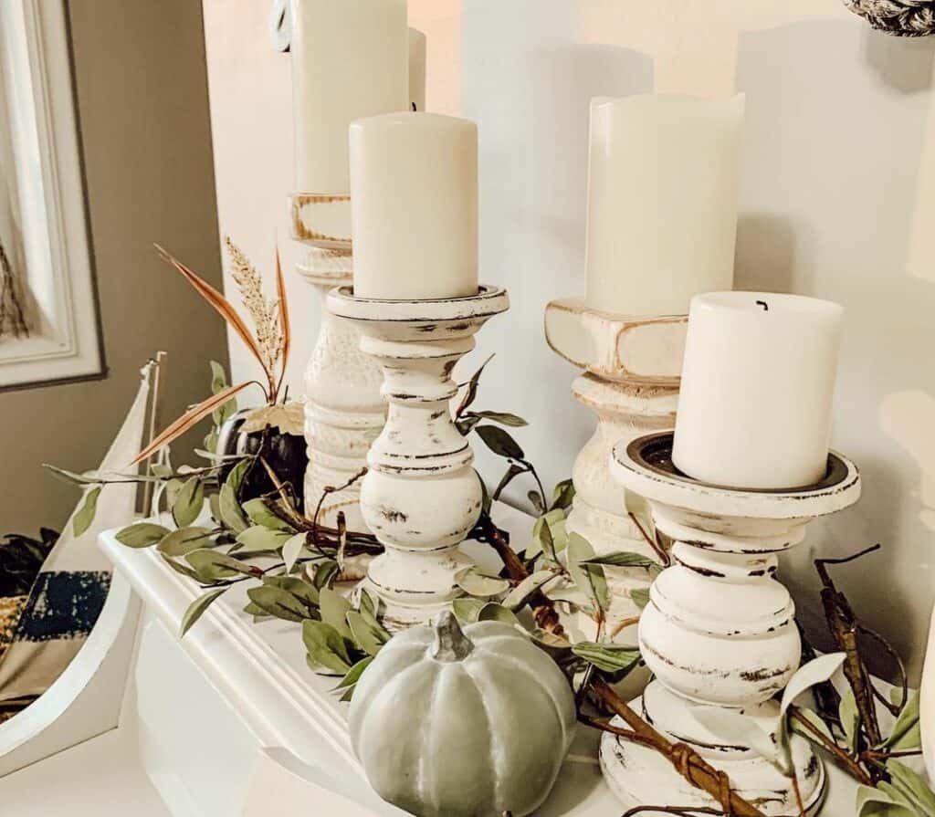 Rustic Candle Holders on a White Piano