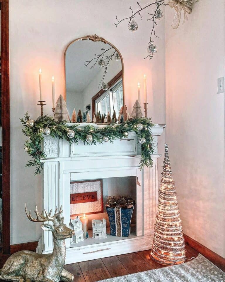 Silver Christmas Decorations Across a Faux Fireplace
