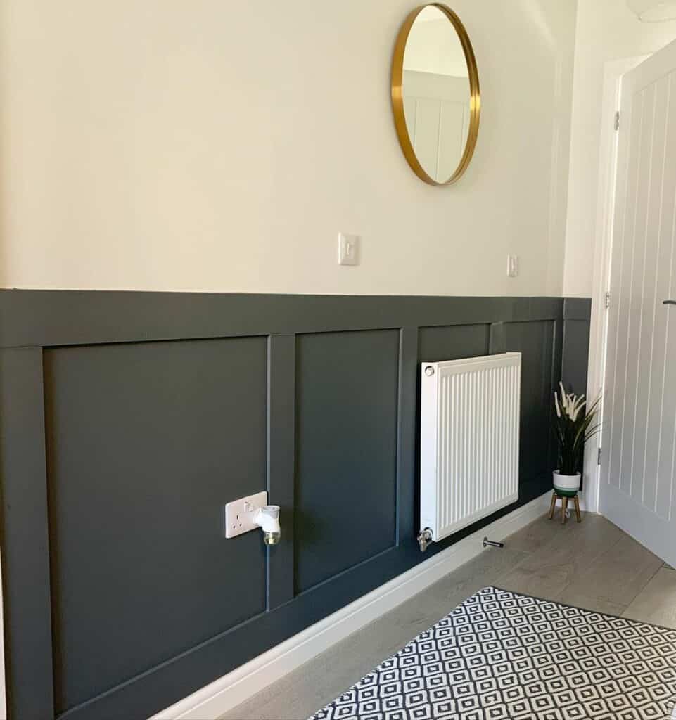 Sleek Gray Entryway Design With Gold Mirror