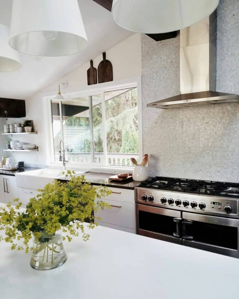 Stainless Steel Appliances Against Glossy Gray Tile