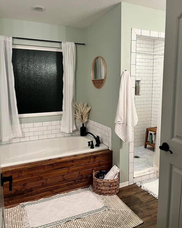 Alcove Bathtub Framed With Stained Wood