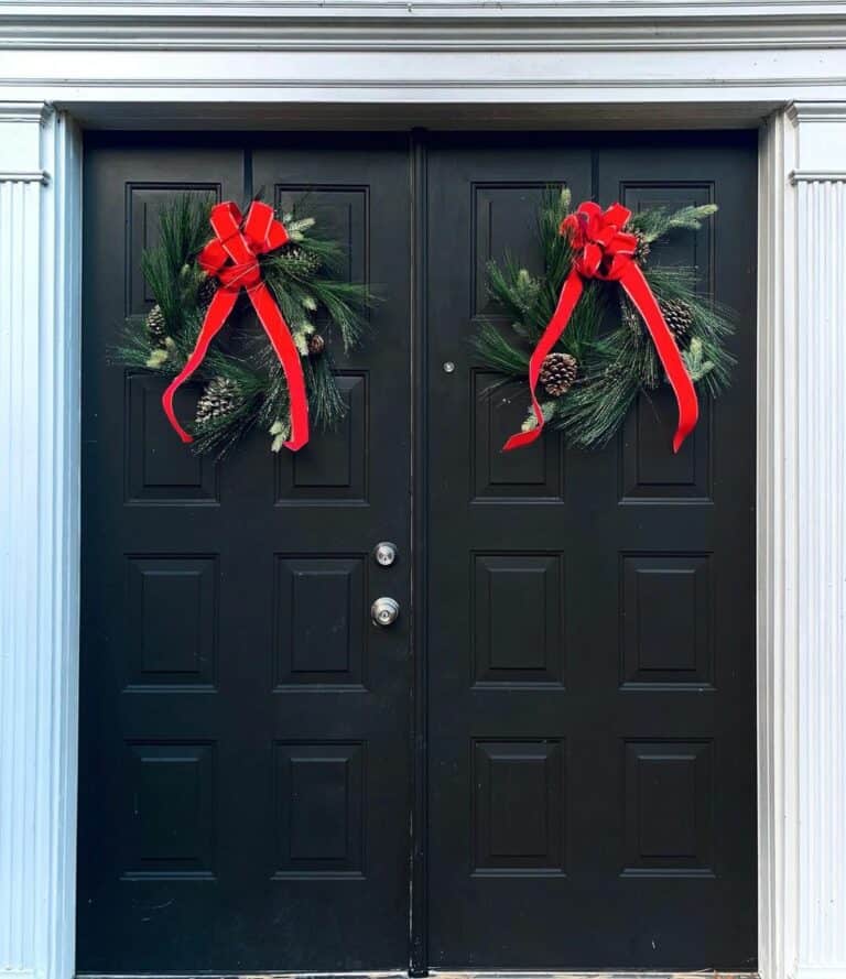 Bright Red Bows Tied to Door Wreaths