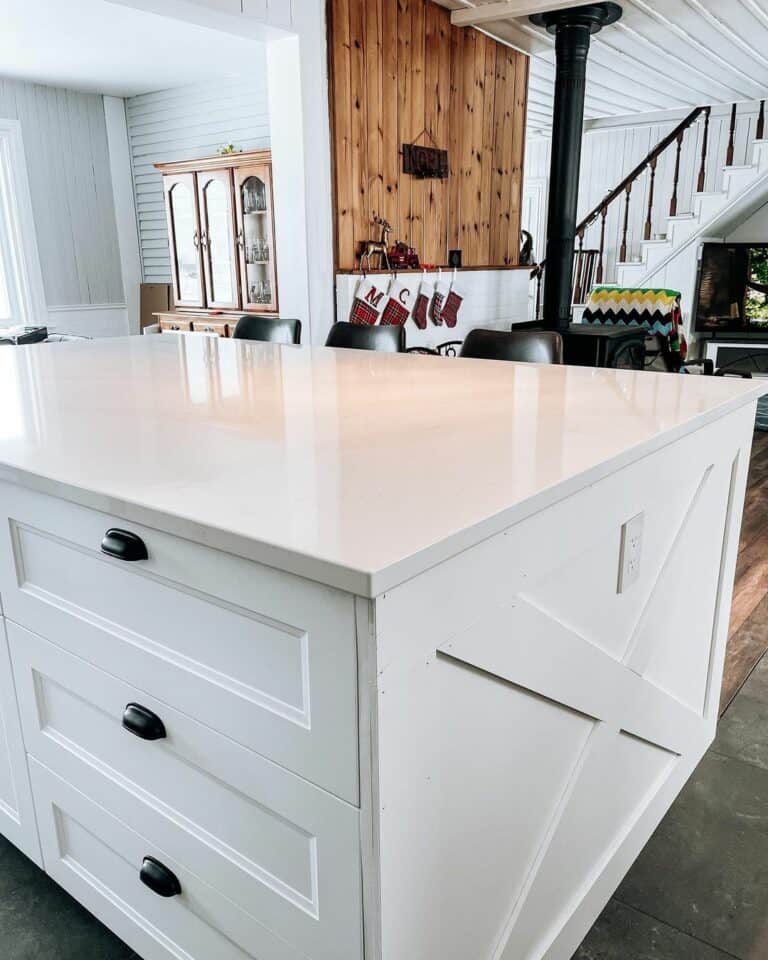Contrasting Counter Stools Beside a White Island