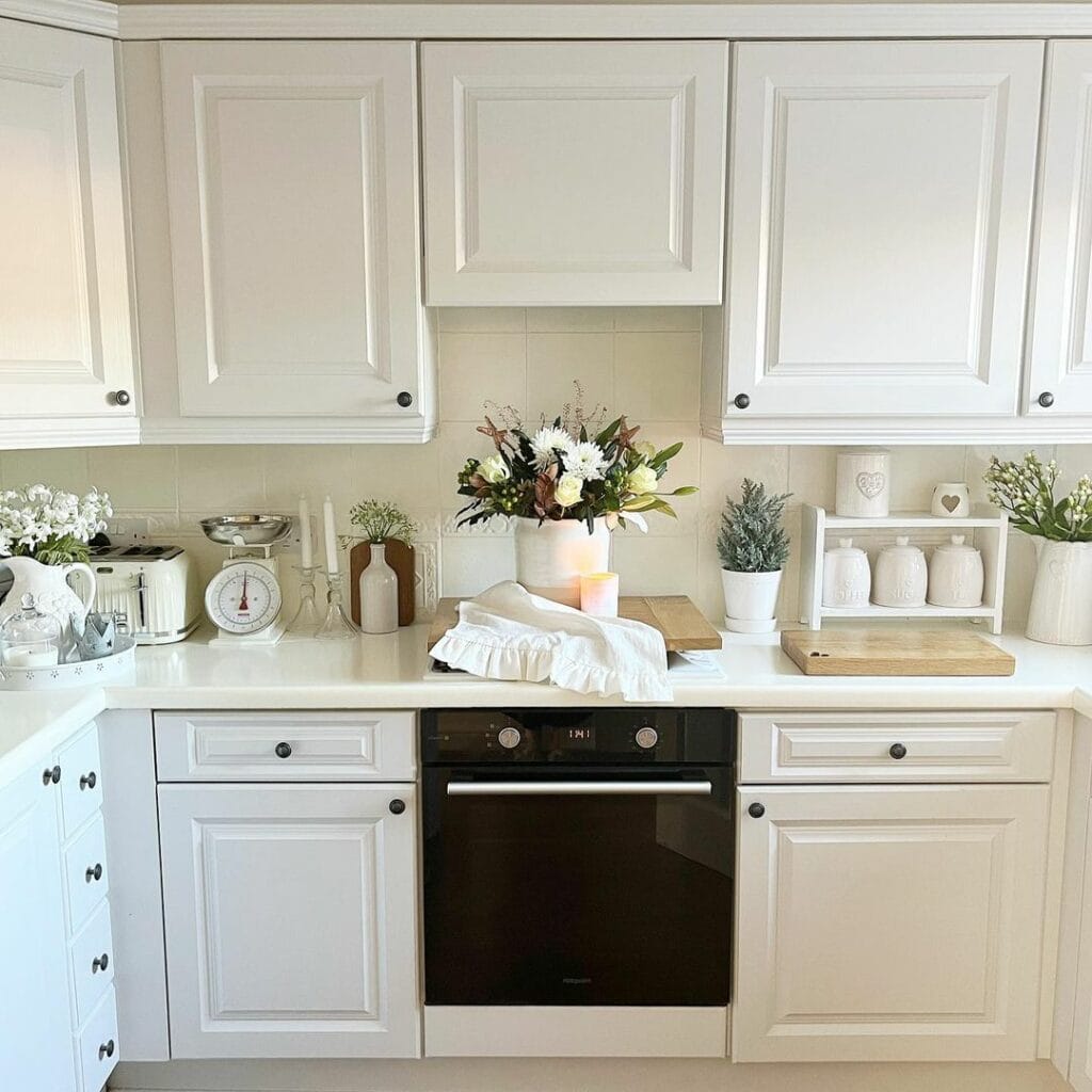 Cottage-core White Kitchen With Floral Accents