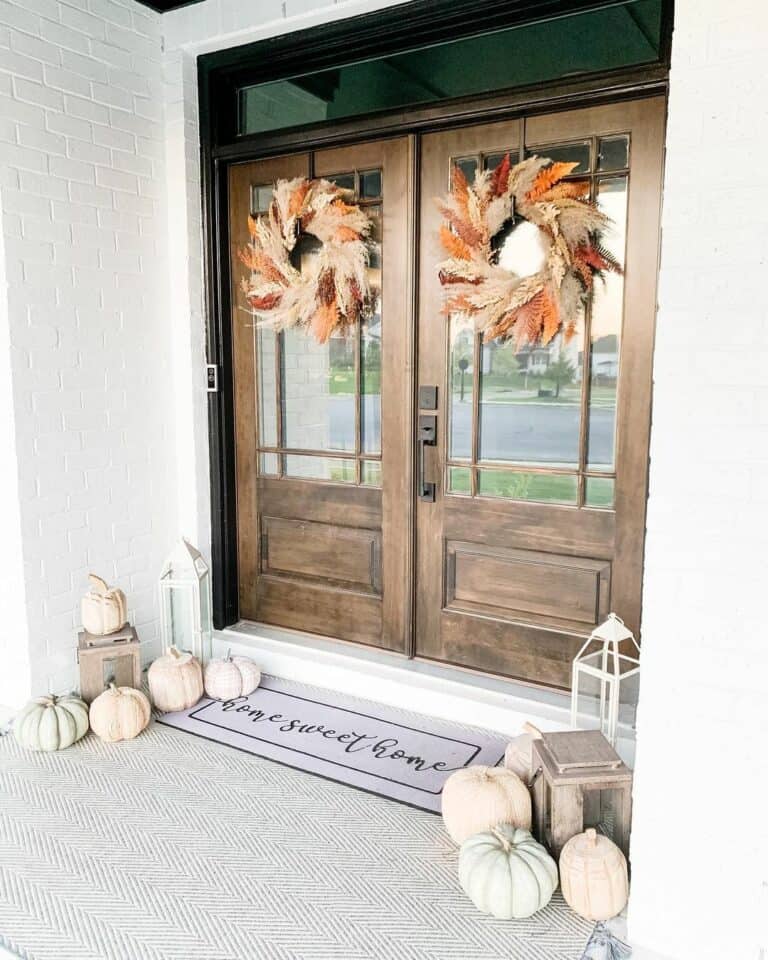 Double Front Doors Hung With Extravagant Wreaths