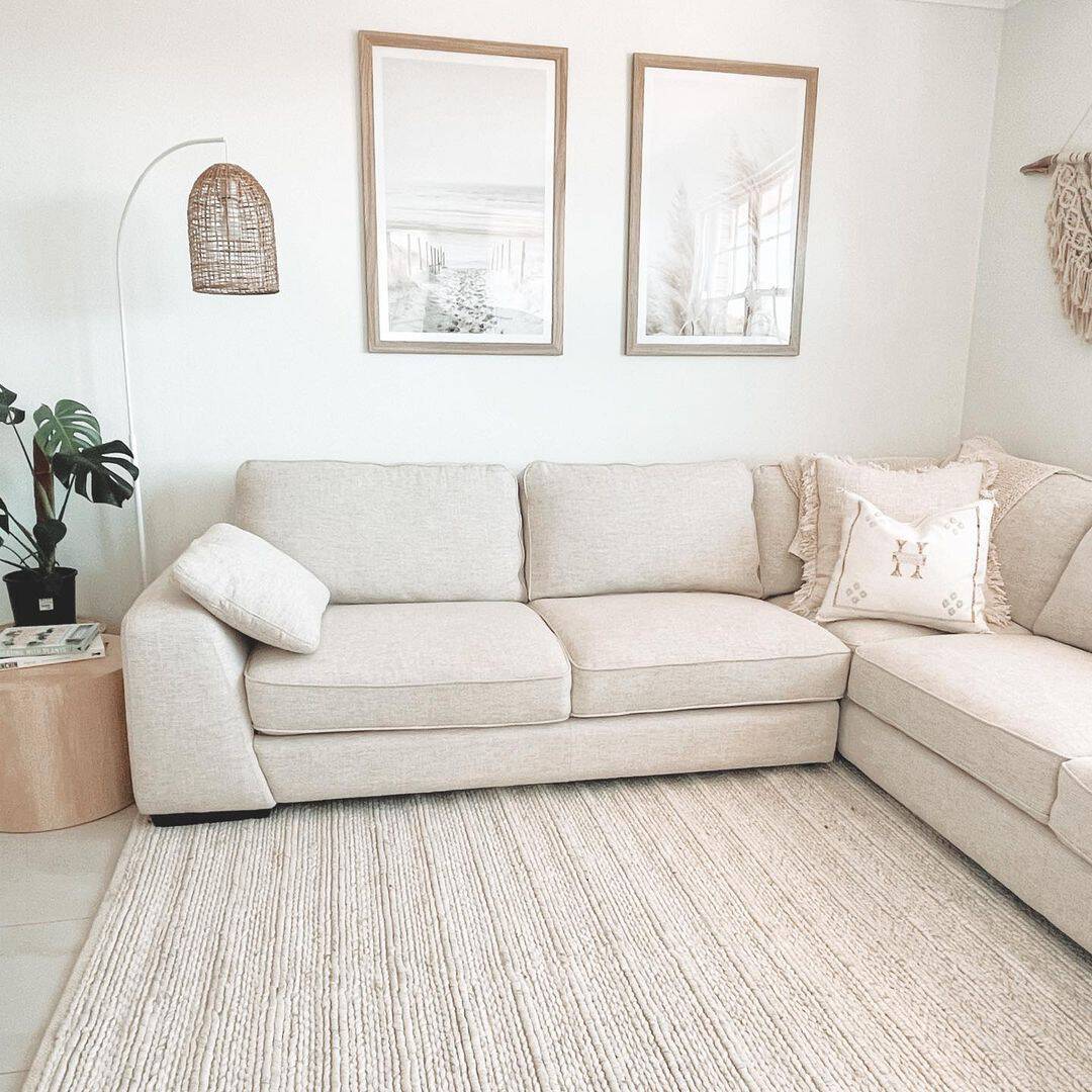 Placing sofas and chairs against walls to maximize central floor space