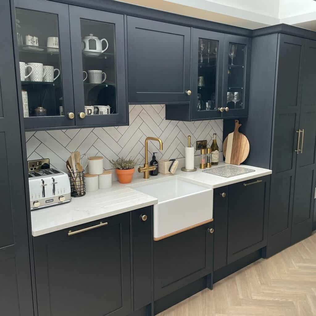 Glass Paneled Cabinets and Herringbone Tile Backsplash